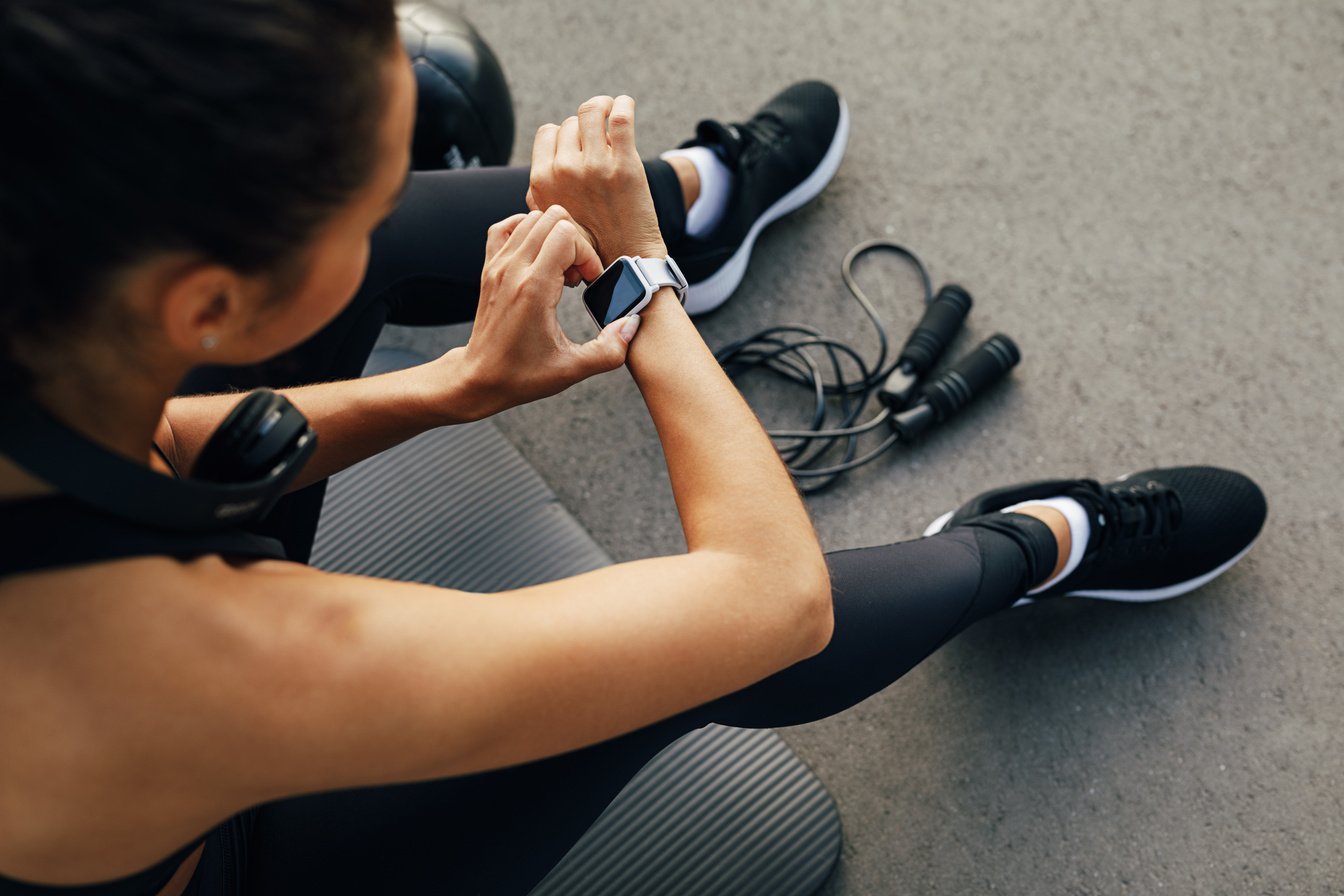 Fit Woman Looking at Smart Watch